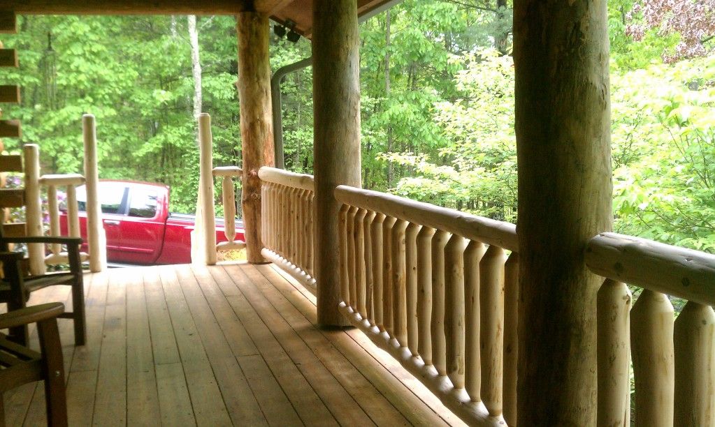 Cedar railing on a front porch Wiley Log Homes